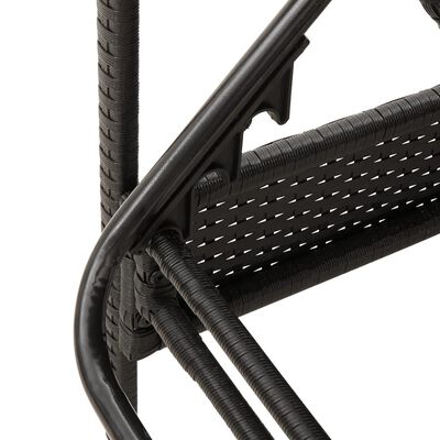 Close-up of woven wicker and metal joint on chaise lounge arm