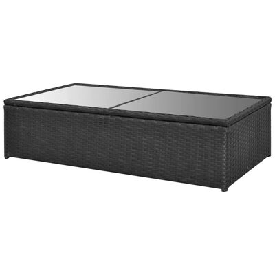 Rectangular coffee table with glass top in dark wicker.