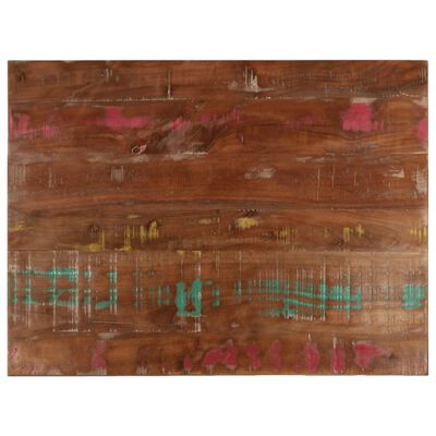 Abstract painted wooden plank with colorful splotches seen on a flat surface