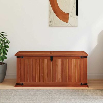 Wooden chest with lid closed, vertical slat panels, black metal hardware.