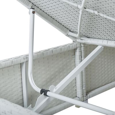Close-up of metal support frame and wicker weaving on the underside of outdoor furniture.