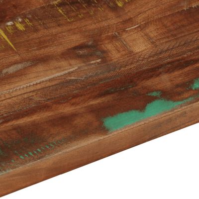Close-up of stained wood with turquoise paint patch and wood grain