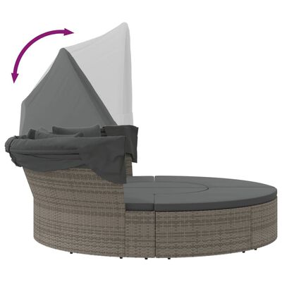 Outdoor daybed with canopy in folded position and protective cover on fabrics