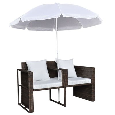Wicker outdoor furniture set with umbrella and two-seat sofa, white cushions.