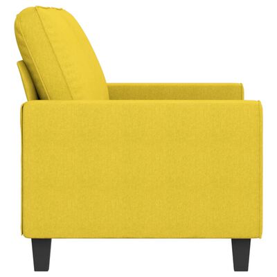 Close-up side view of the yellow sofa, focusing on armrest and upholstery.