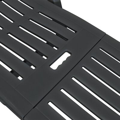 Close-up of the slatted seating surface showing gaps between slats