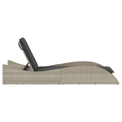 Side profile of a rattan chaise lounge in an adjustable reclining position.