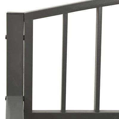 Close-up of the bench frame showing vertical metal bars and rectangular post joint