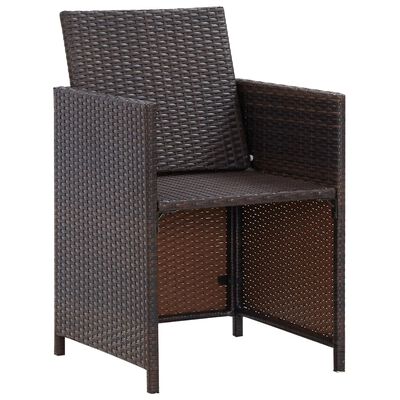 Corner view of brown wicker armchair with beige cushions
