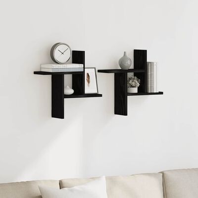 Two black wall shelves with decorative items placed on them in a living room setting