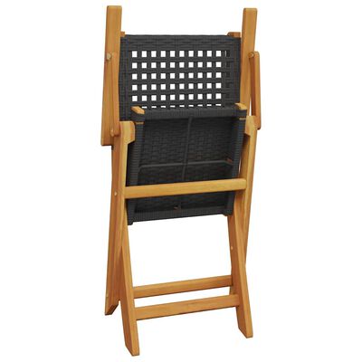 Back view of a folded wooden folding chair with grey woven seat and backrest.