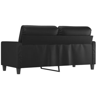 Back view of the black sofa showing storage or cover along the back and legs.