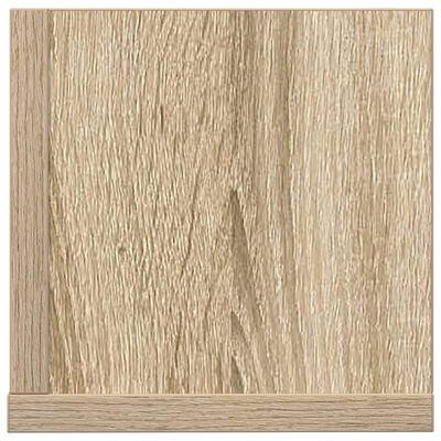 Close-up of wood grain on wooden cabinet or shelf panel, showing texture and color.