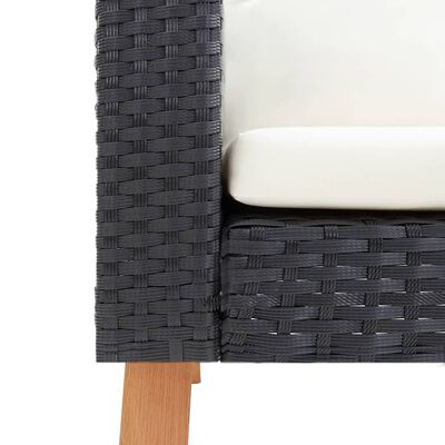 Close-up of corner of dark woven outdoor furniture showing wicker pattern and cushion edge.