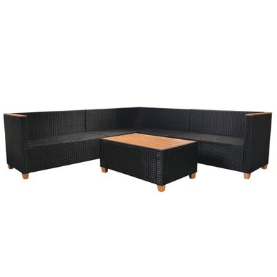 Black wicker sectional set in L-shape with a central coffee table and beige cushions.