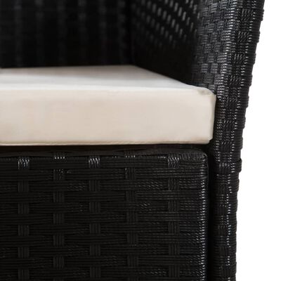 Close-up of the seat cushion and woven wicker texture on a black outdoor chair.