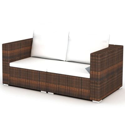 Brown wicker loveseat with white seat and back cushions