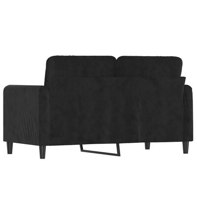 Back view of a black sectional sofa showing cushions and metal leg support.