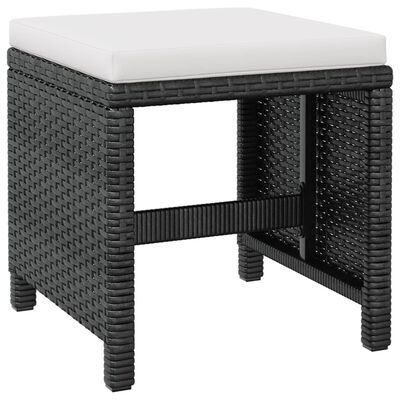 Wicker ottoman with white cushion, open space underneath and sturdy legs.