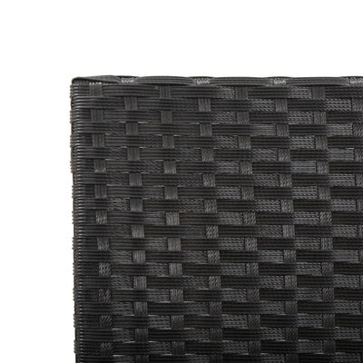 Close-up of woven wicker texture on dark patio furniture
