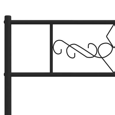 Close-up of the headboard detail showing decorative scrollwork on the metal frame.