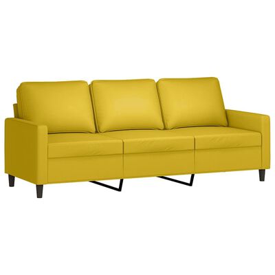 Yellow three-seat sofa with three back cushions and metal legs, left arm is visible