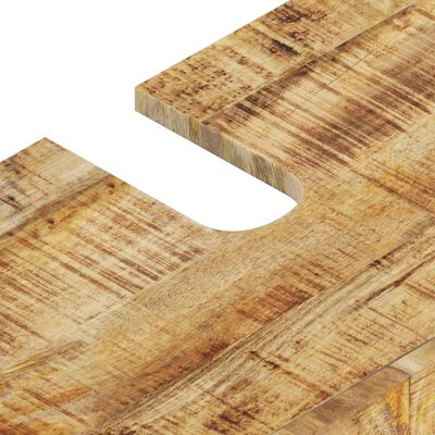 Close-up of a cutout on the edge of a rustic wood cabinet