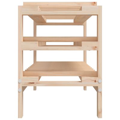 Underneath view of a wooden wine rack showing slatted shelves and frame
