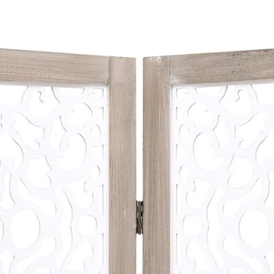 Close-up of top corner of wood frame showing join and white decorative cut-out panel.