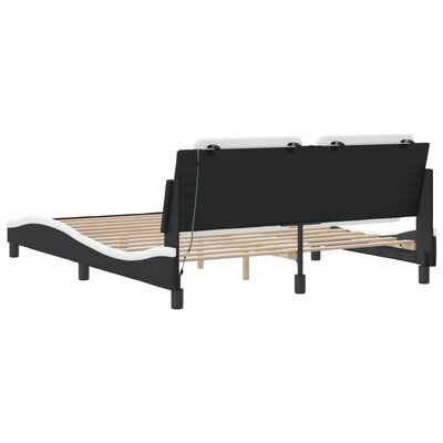 Back view of bed showing a folding mechanism and slatted base