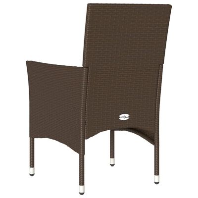 Back view of brown wicker chair showing curved weave and legs