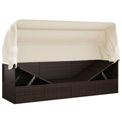 Outdoor wicker sofa with canopy, storage compartments visible under bed, with cushions.