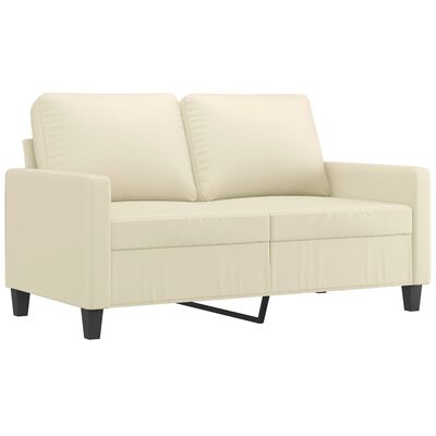 Close-up of the beige sofa armrest and seat cushion showing stitched upholstery.
