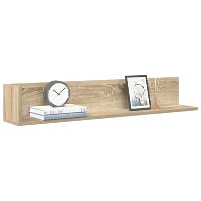 A wooden wall shelf with a clock, books, and a framed photo placed on the shelf, mounted on wall.