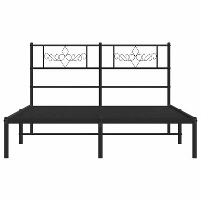 A large black metal bed frame with a high headboard that has decorative metal panels, and a low footboard.