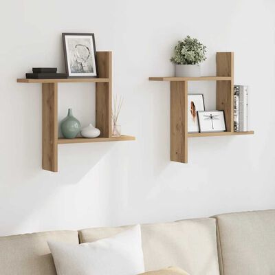 Two wooden wall shelves mounted on a wall, displaying decor and books.