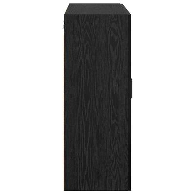 Narrow tall black wood cabinet from side, with handle