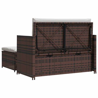Back of brown wicker storage ottoman with hinged lid and metal frame.