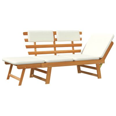 Angled view of chaise lounge section attached to outdoor sectional with white cushions