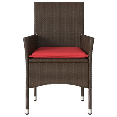 Front view of brown wicker armchair with red cushion