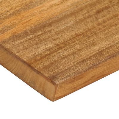 Close-up corner of a wooden cutting board showing the beveled edge and end grain.