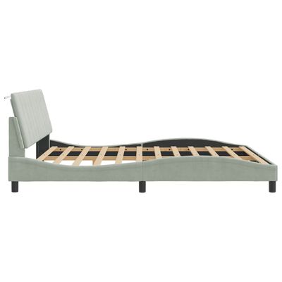 Side view of bed frame with angled footboard and hinged mechanism showing adjustable head/foot positions.