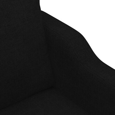 Close-up of interior seam and fabric texture on the arm of a dark gray sofa