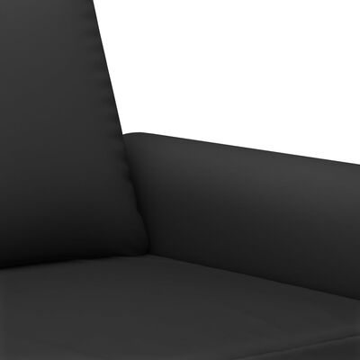Close-up of sofa armrest and seat cushion in black upholstery