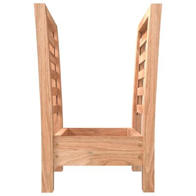 Side view of a wooden slatted rack showing its tall vertical supports and bottom drawer area