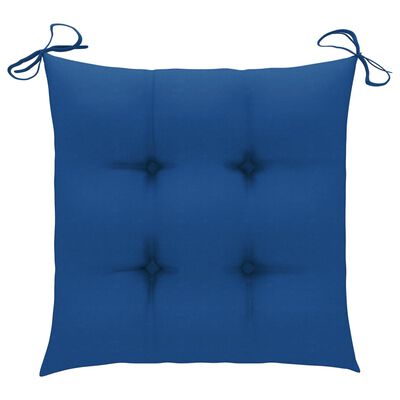 Close-up of blue tufted cushion corner showing tufted buttons