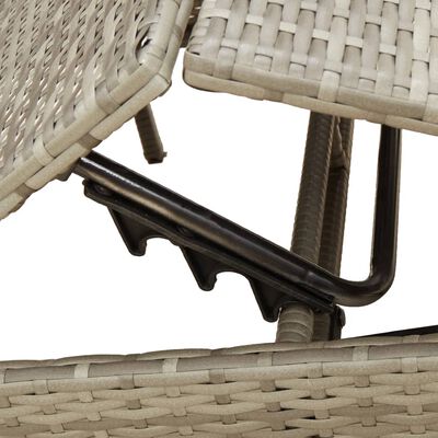 Close-up of wicker weaving and metal frame connections under the armrest.