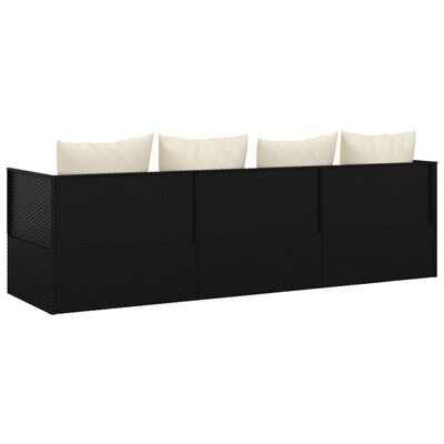 Long black wicker modular sofa with multiple sections and beige cushions