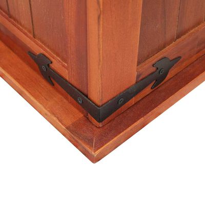 Corner of wooden chest with black metal strap and corner brace