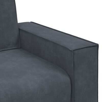 Close-up of sofa armrest with seam and upholstery texture.